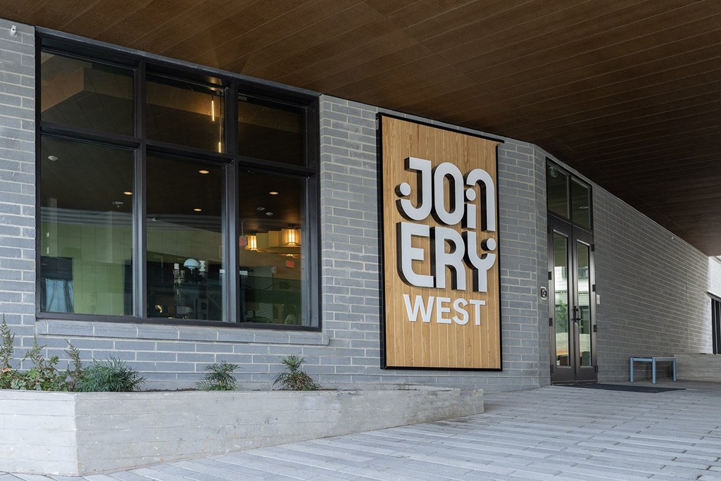 A building with a sign that says Jon Ery West.