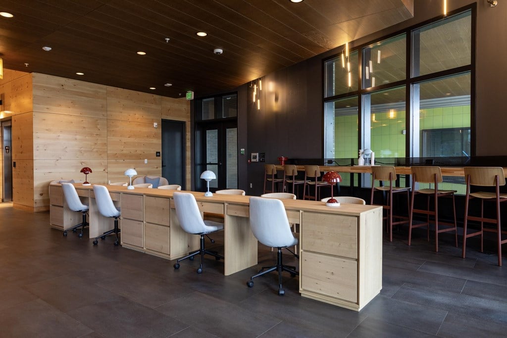 A room with a long table and chairs.