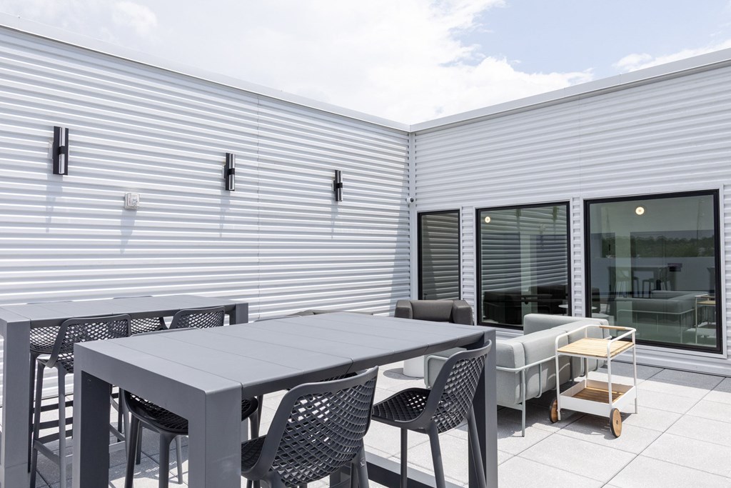A patio with a table and chairs is shown.