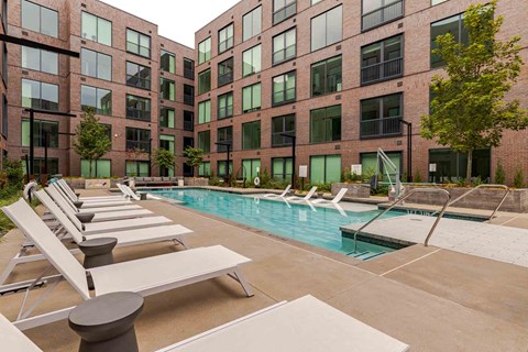 Resort-style pool with loungers