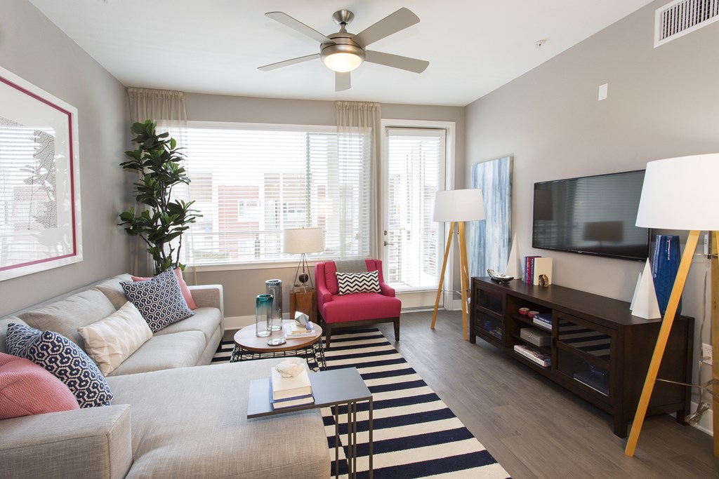 a living room with a couch coffee table and tv