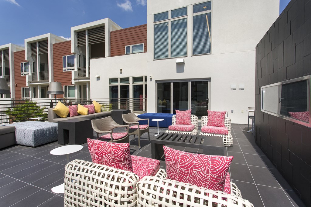 a patio with chairs and tables