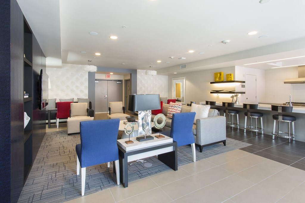 a resident clubhouse with couches chairs and a coffee table