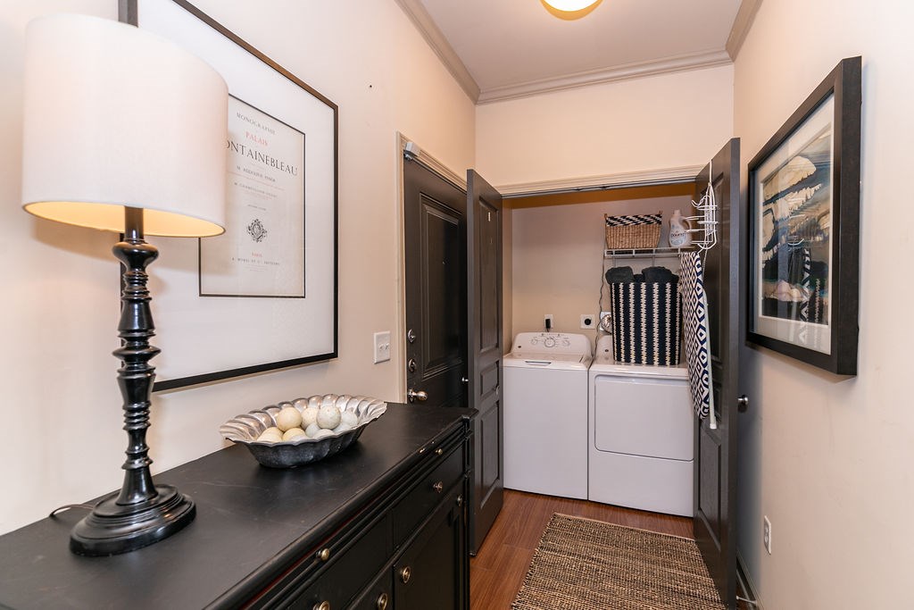 A black table with a lamp and a bowl of eggs on it.