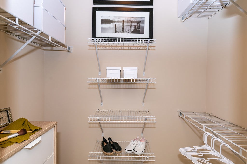 A closet with shelves and shoes on them.