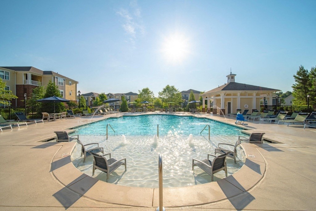 our apartments have a large pool with chairs