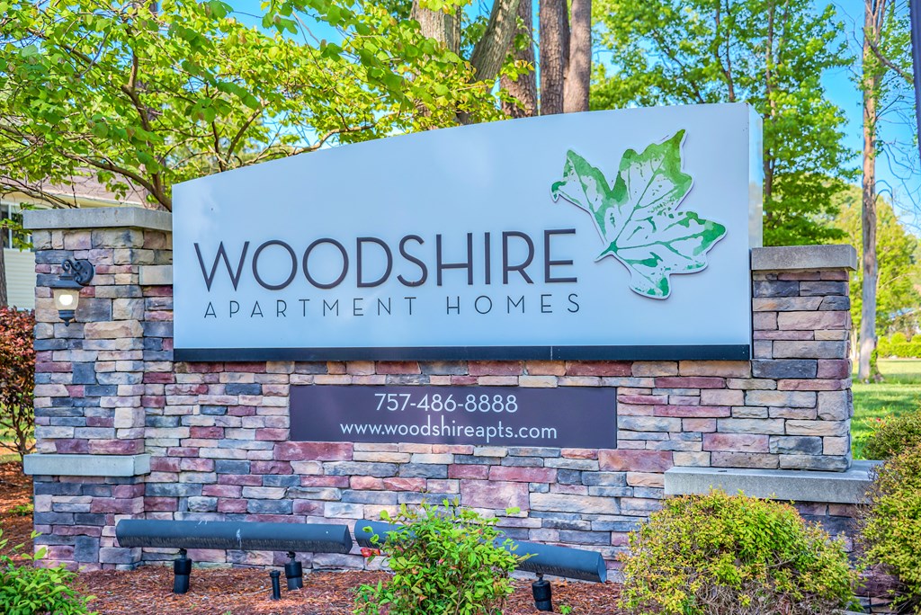 a sign for wood shore apartment homes