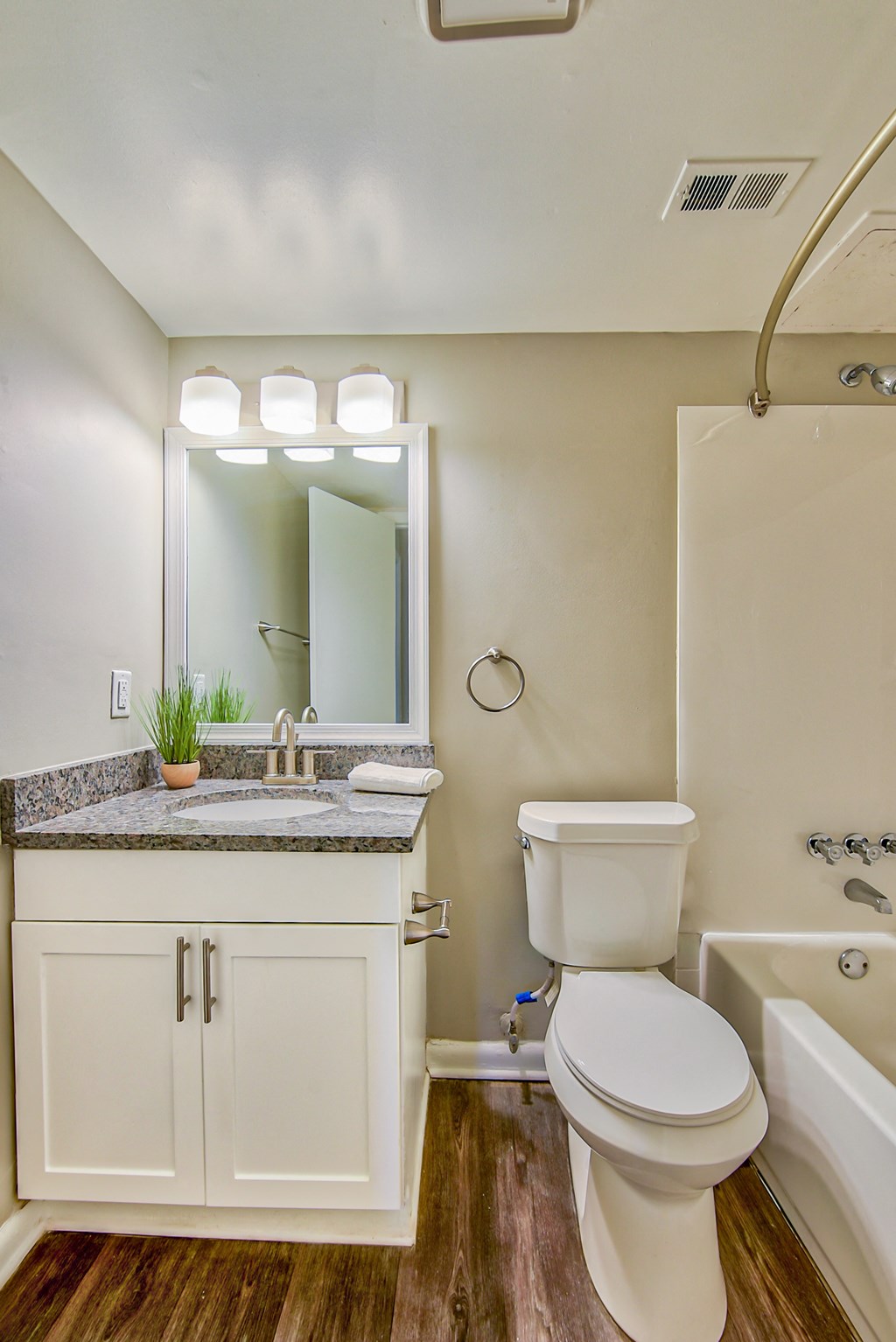a bathroom with a toilet sink and bathtub