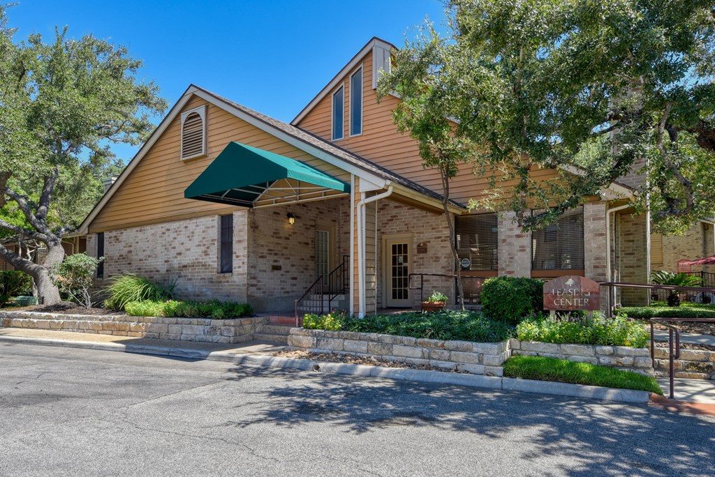 a brick building with a green awning