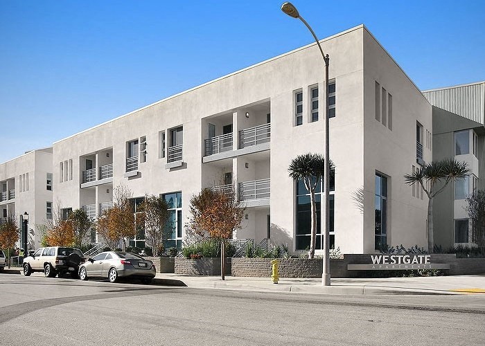 a white building with a street light in front of it