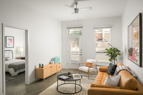 Living room with bedroom on left