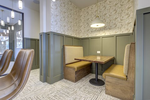 A room with a table and chairs.