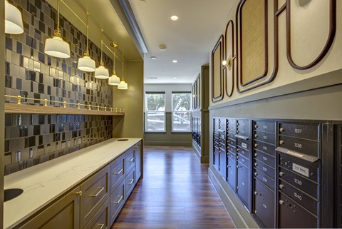 A kitchen with a checkered tile backsplash and dark wood cabinets.