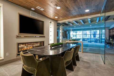a dining room with a fireplace and a table with chairs