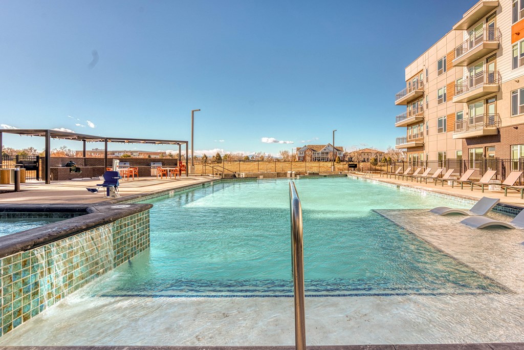 Swimming pool with sun shelf