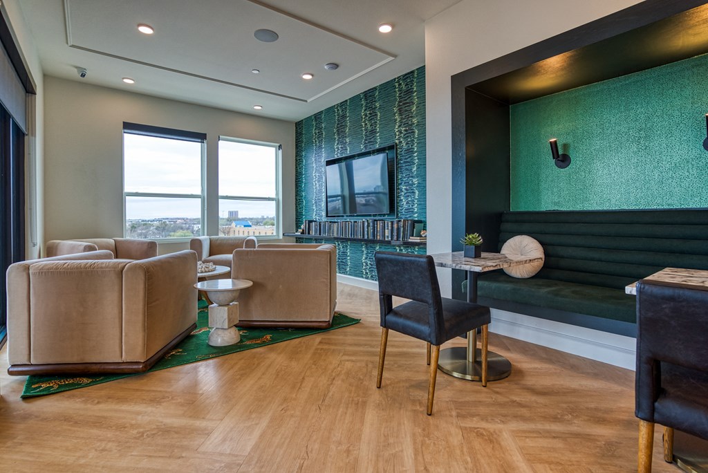 a living room with couches chairs and a table