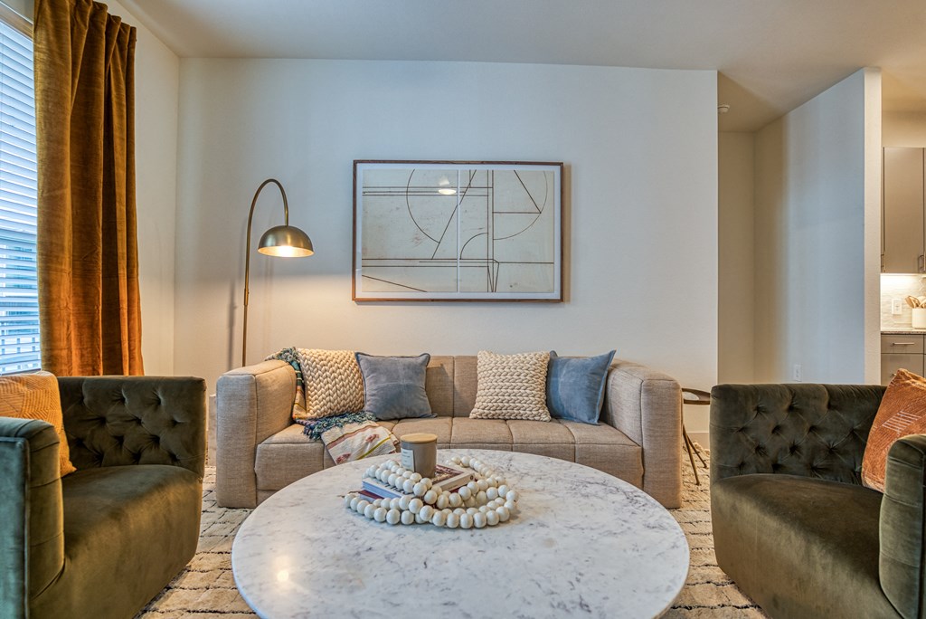 a living room with couches and a coffee table