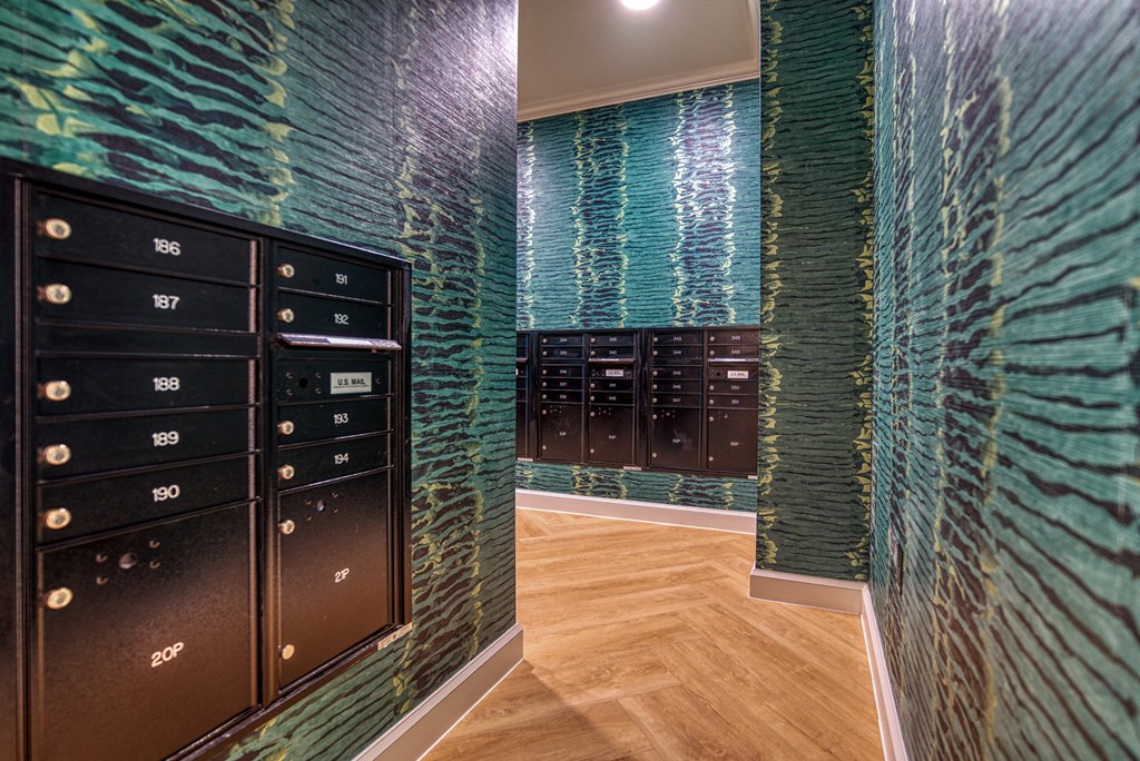 a locker room with blue and green glass and a wooden floor