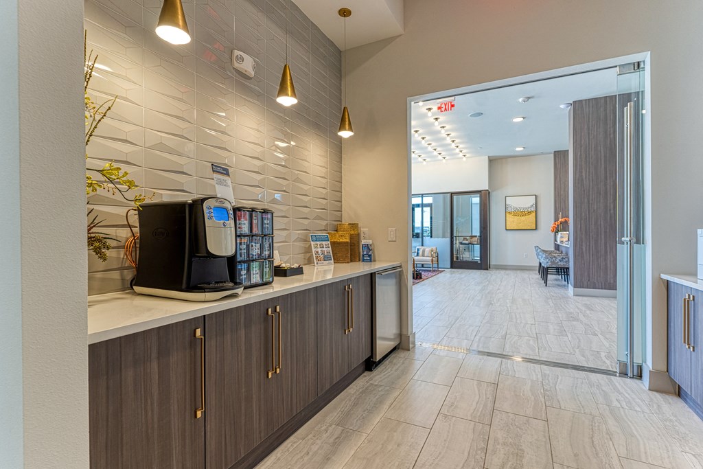 a coffee machine sits on a counter in the lobby of a building