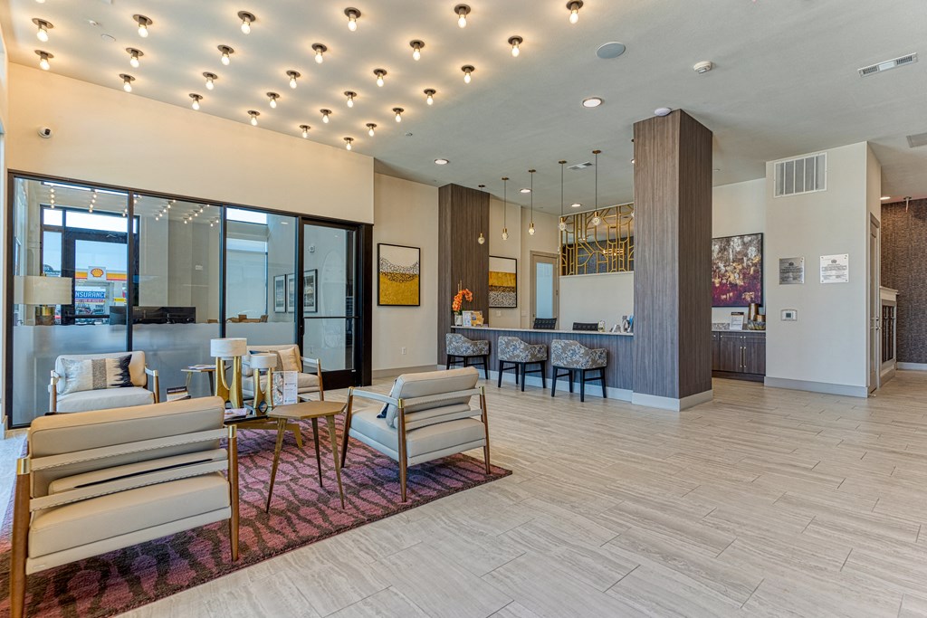 a resident clubhouse with a reception desk and lounge area