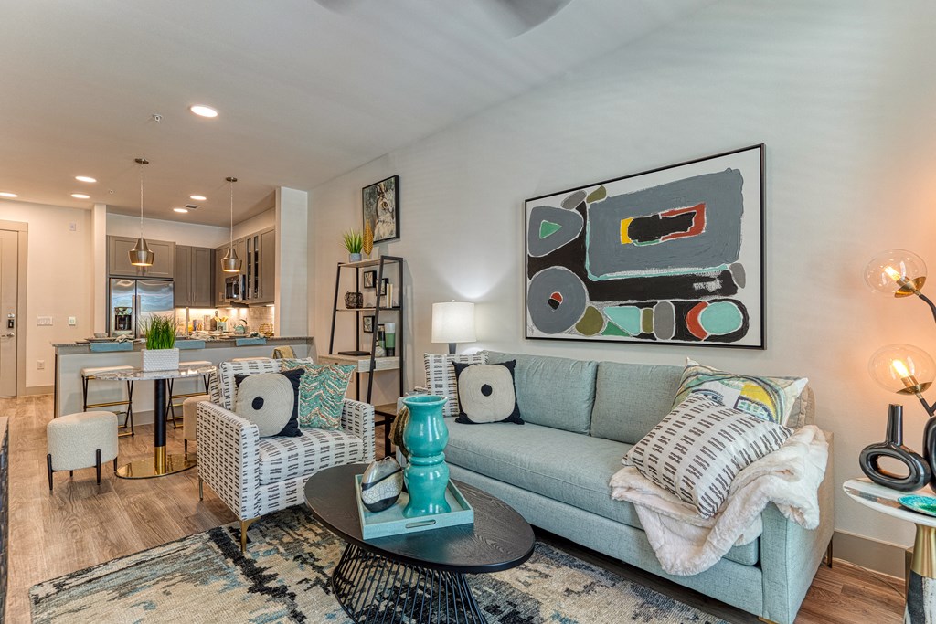 Apartment living room with hardwood floors and 9 foot ceilings