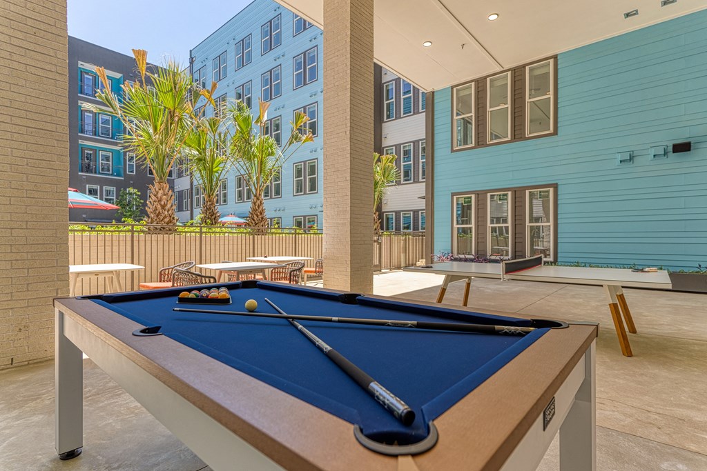 play a game of pool at the reserve at riverdale apartments in riverdale, nj