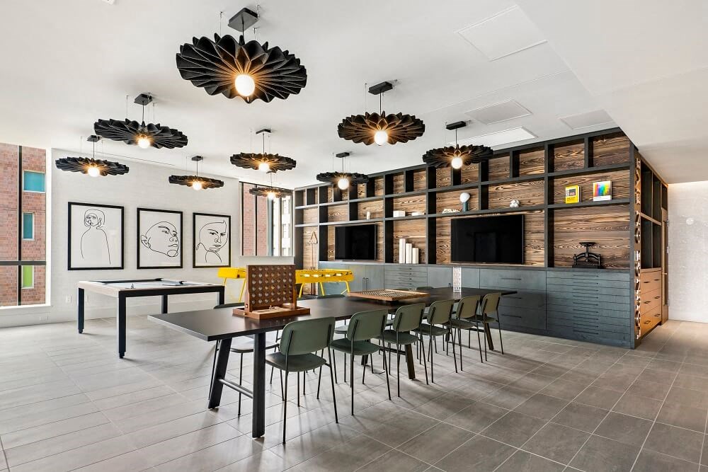 a large dining room with a long table and chairs