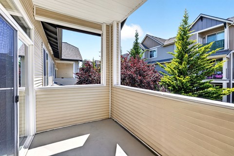 A balcony with a view of a residential area.