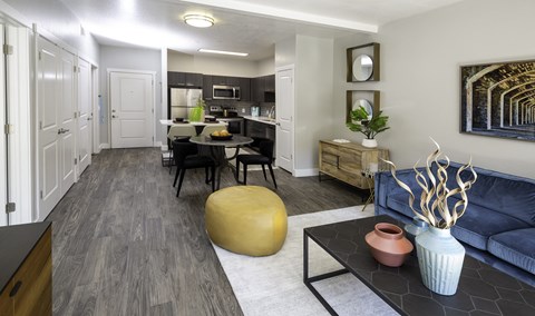 A modern kitchen with a dining table and chairs.
