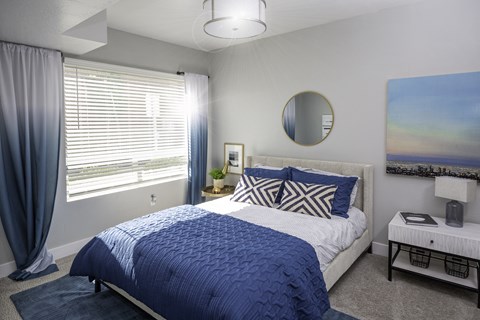 Bedroom with Blue and White Bed at 644 City Station, Salt Lake City, Utah