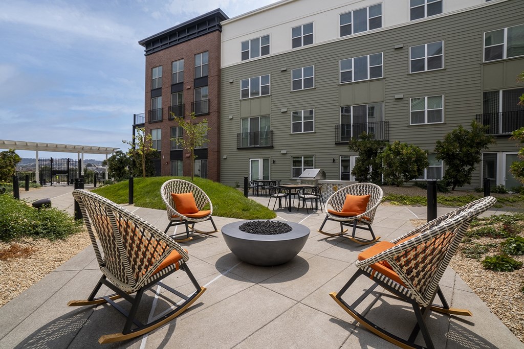 outdoor seating, four chairs around a circular fire pit