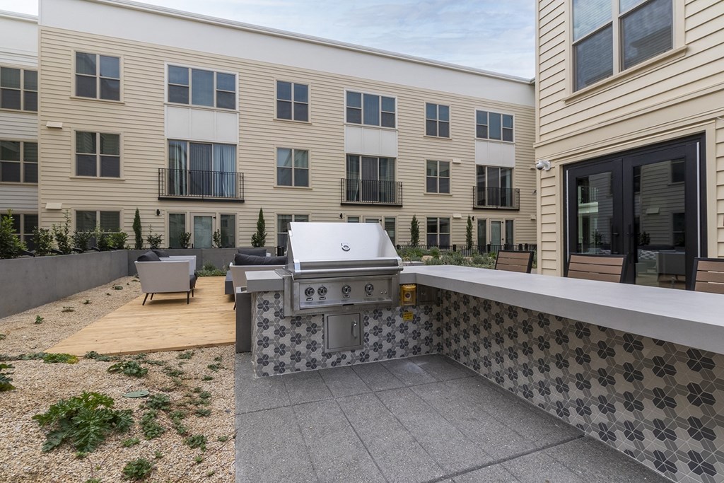gas grill for residents with countertops to prepare food on