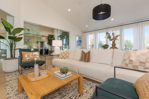a living room with a white couch and a coffee table