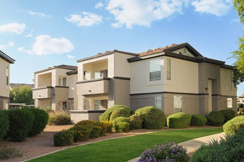 a render of a house in a yard with grass and bushes