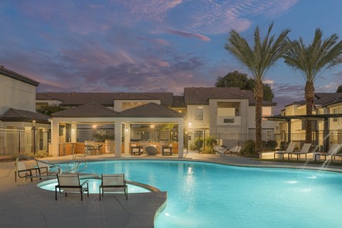 a swimming pool at night at the resort at governors crossing