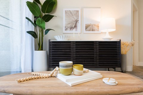a coffee cup on a stack of books on a table