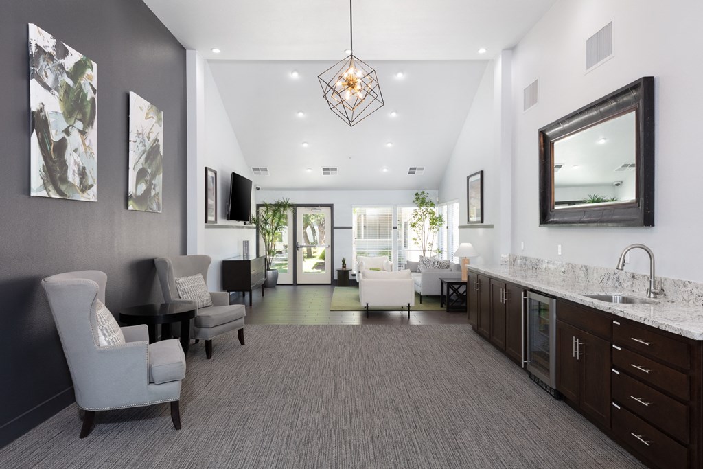 a living room filled with furniture and a large window