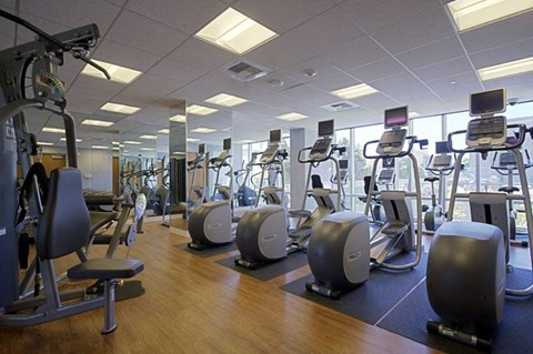 Luxury Apartments in San Francisco, CA for Rent - Trinity Place at 1188 - Fitness Center with Elliptical Machine and Floor-to-Ceiling Windows