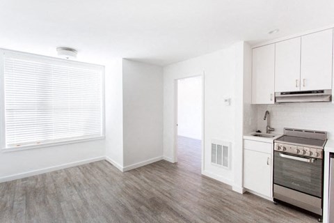 a kitchen and living room in a 555 waverly unit