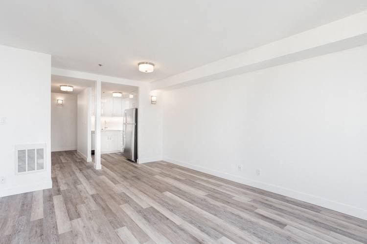 a kitchen and living room in a 555 waverly unit