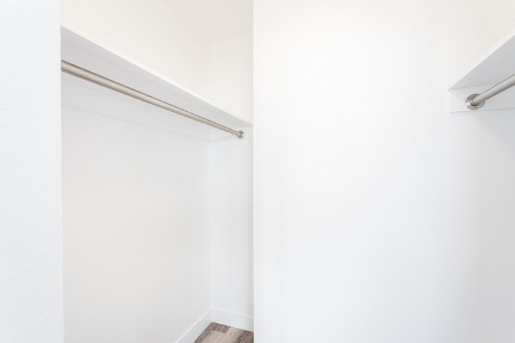 a walk in closet in a 555 waverly unit