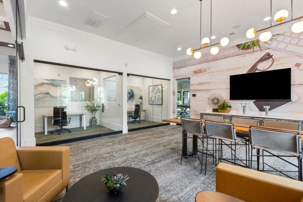 A modern living room with a flat screen TV mounted on the wall.