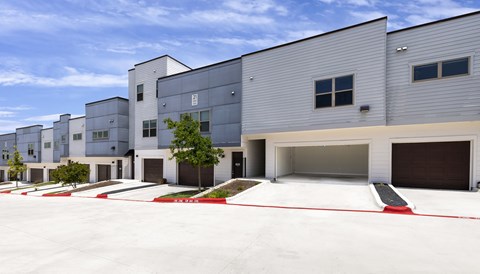 A row of modern buildings with a clear sky above.