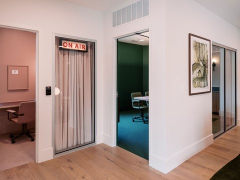 A room with a sign that says "ON AIR" on a door.