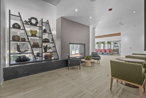 A modern dining area with a wooden floor and a glass display cabinet.