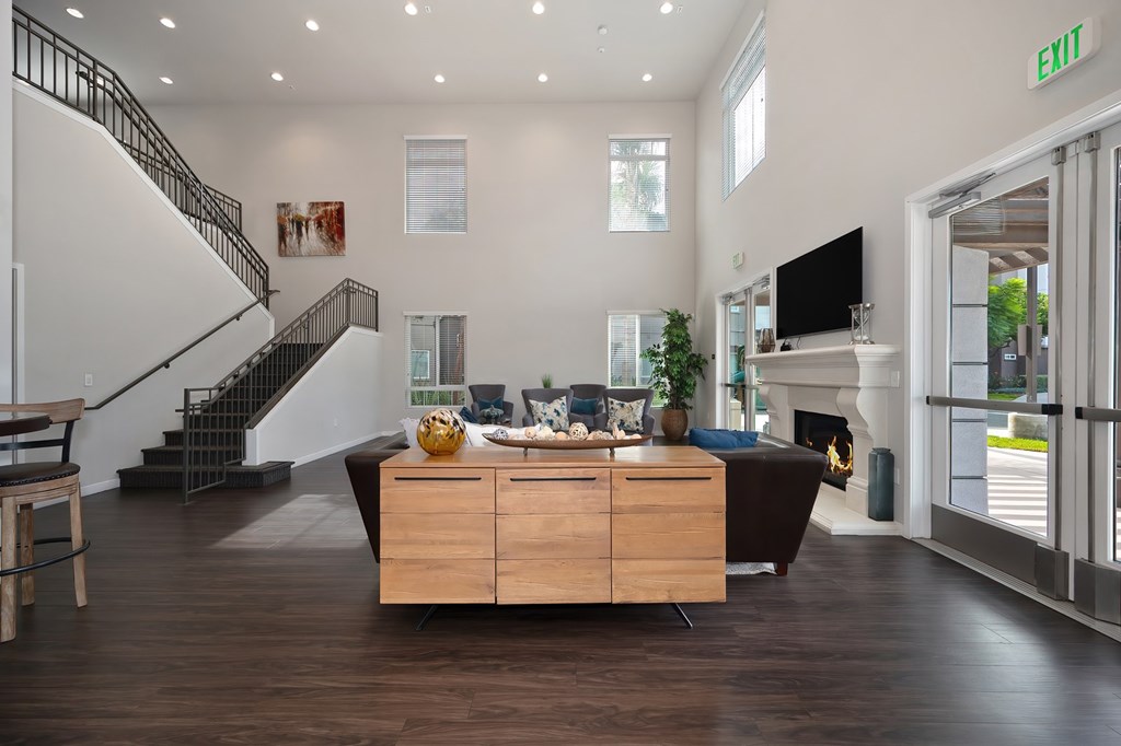 A living room with a staircase and a couch.