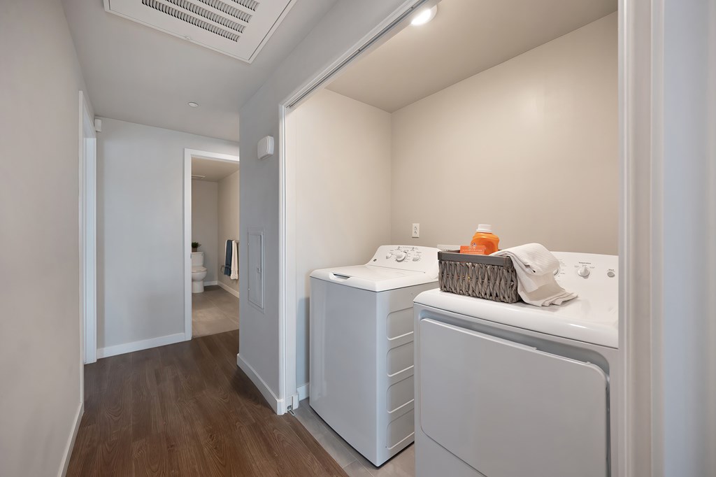 A laundry room with a washer and dryer.
