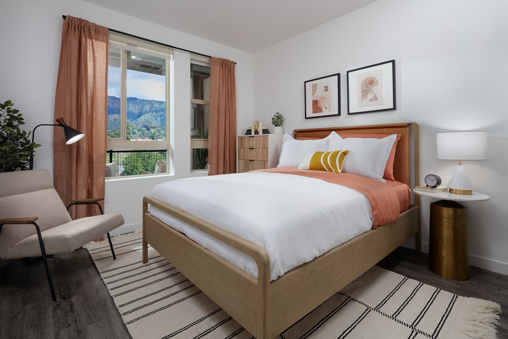 model bedroom with a bed and a chair