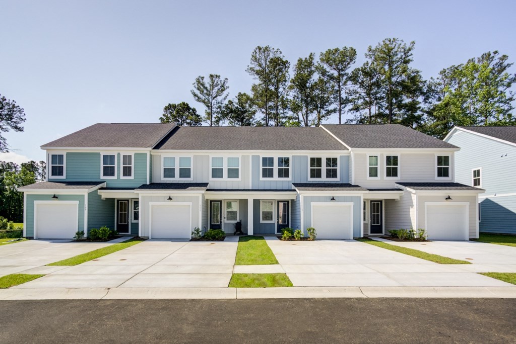 a house with blue siding and white doors and shutters at Berkeley Homes, Moncks Corner, SC