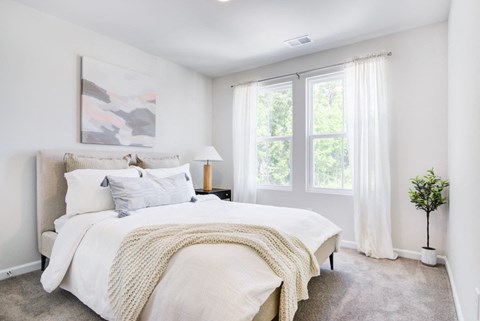 Brightly lit bedroom at Berkeley Homes at Berkeley Homes Apartments, Moncks Corner, SC, 29461